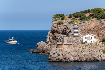 View of the lighthouse at the entrance to Soller Bay, Port de Soller, Mallorca, Spain. Famous, tourist destination