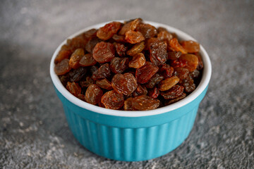 Close up of dark raisins - dried grapes, vegetarian nutrition, healthy food, nutrition for heart muscle