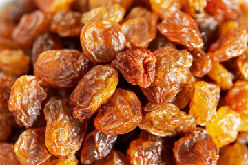 Close up of dark raisins - dried grapes, vegetarian nutrition, healthy food, nutrition for heart muscle