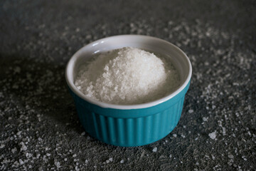 Granulated sugar in a bowl, close-up, culinary raw material