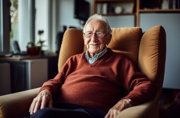 Elderly man in burgundy armchair watching TV in his room - middle shot portrait - Powered by Adobe