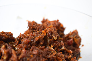 Close up Sambal ikan teri or anchovy chili fried is indoneisan side food, Indonesian chili sauce. Sambal ikan teri shoot on White Background.