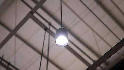 The light bulb on the ceiling flickered.