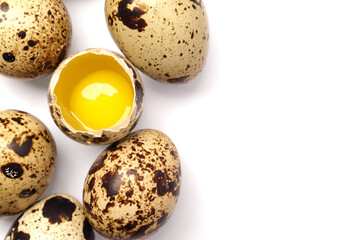 Half broken Quail eggs isolated on white background. Top view