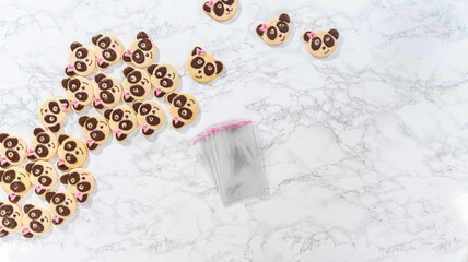 Panda shaped shortbread cookies with chocolate icing