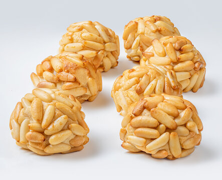 Panellets pine nuts close up. Typical Catalan dessert panellets of All Saints holiday, known as Castanyada