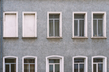 Fototapeta na wymiar White double PVC windows. Gray wall.
