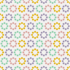 Colored dots in the form of circles. Abstract geometric seamless pattern