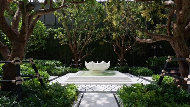 Symmetrical luxury garden with a grand fountain a harmonious oasis of opulence and design precision. This exquisite scene features a perfectly balanced layout, framing an ornate fountain .
