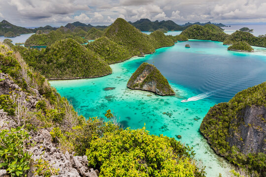 A view from on top of the small islets of the natural protected harbor in Wayag Bay, Raja Ampat