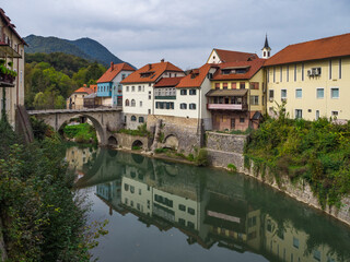 Fototapeta na wymiar City of Skofja Loka, Slovenia with view of the Capuchin Bridge over the Selska Sora River in the old city center