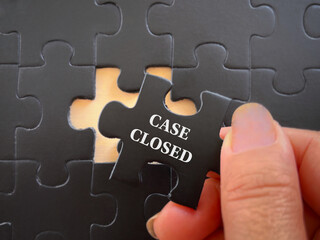 Social issues, law and justice concept. CASE CLOSED written on puzzle set. With blurred styled background.
