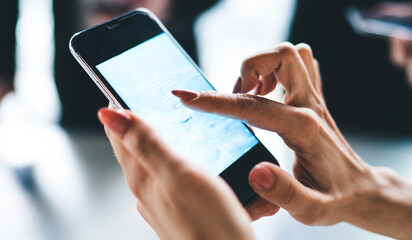 Female hands entering account information in smartphone app