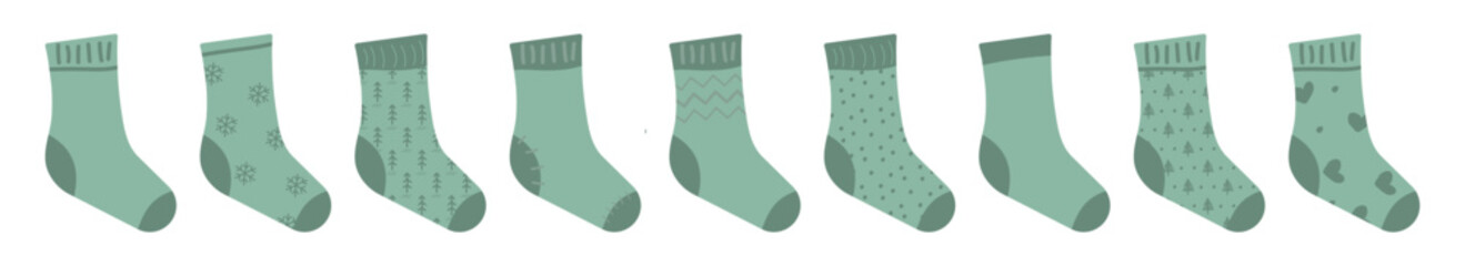 Collection of warm knitted socks in green. Isolated set of fashionable clothes