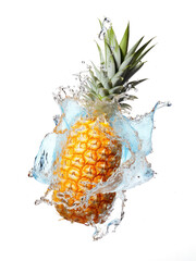 Pineapple splashing in water on white background