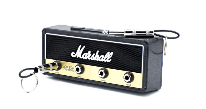 Marshall Amplification Jack Rack Key holder JCM 800 Lead Series Master Volume Head replica 4 guitar plug input keychain isolated on white background Gold brushed metal face plate and black amp fabric