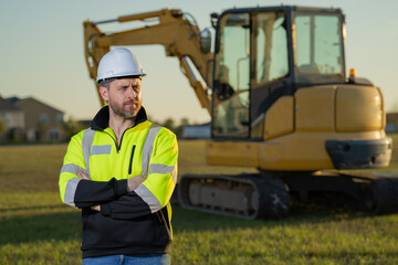 Worker at building site. Construction manager in helmet. Male construction engineer. Architect at a construction site. Handyman builder in hardhat. Building concept. Builder foreman.
