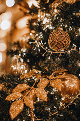 Golden shiny leaves and Christmas ball hanging on the Christmas