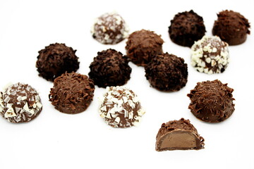 Several chocolates on white background