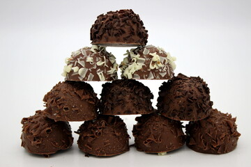 Several chocolates on white background