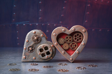 Valentines day background in steampunk style. Two hearts over industrial background with copy space - 666737512