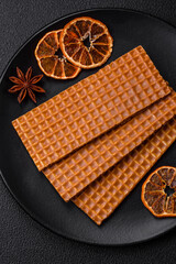 Delicious sweet crispy rectangular waffles on a ceramic plate