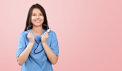 Image of young doctor smiling on color background.