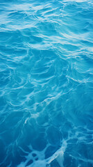 Obraz premium Crystal clear waters, mesmerizing ripples, sunlit ocean surface, tranquil blue depths, elegant wave designs, refreshing sea aesthetics.