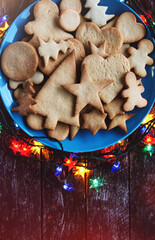 holiday Gingerbread Cookies around garland lights. Merry Christmas and Happy New Year card