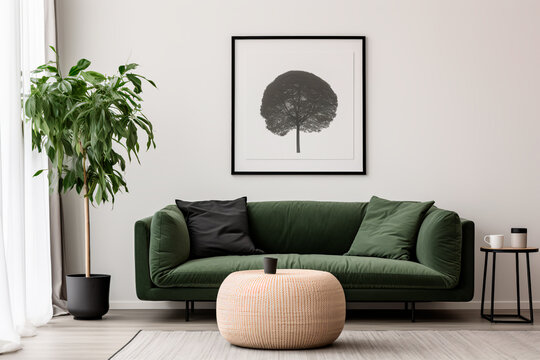 Modern living room with Scandinavian interior design: dark green sofa, grey pouf, white wall, and a large art poster frame.