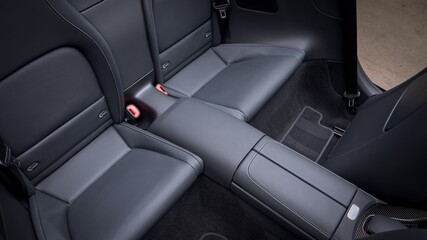 Black leather back seats in a car