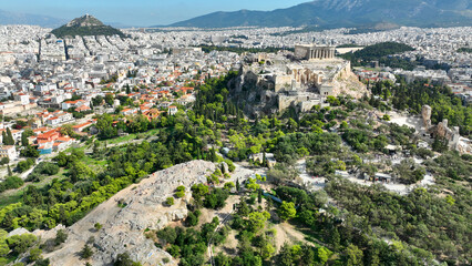 Fototapeta na wymiar Aerial drone cinematic shot above unique Acropolis hill, the Parthenon, Odeon of Herodus Atticus and theatre of Dionysus, Athens historic centre, Attica, Greece
