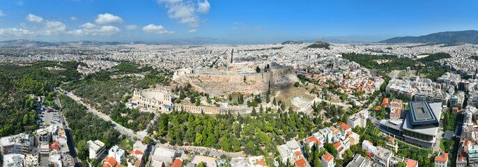 Aerial drone cinematic shot above unique Acropolis hill, the Parthenon, Odeon of Herodus Atticus...