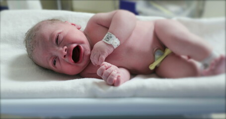 Newborn baby first minutes of life at hospital crying
