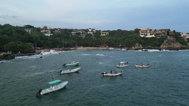 Boats docked in front of Puerto Angelito, Puerto Escondido, Oaxaca