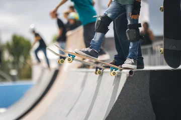 Foto op Aluminium Two skateboarders performing tricks simultaneously. © KONSTANTIN SHISHKIN