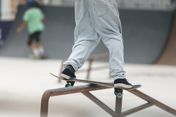 Skater performing a trick with a foot off the board.
