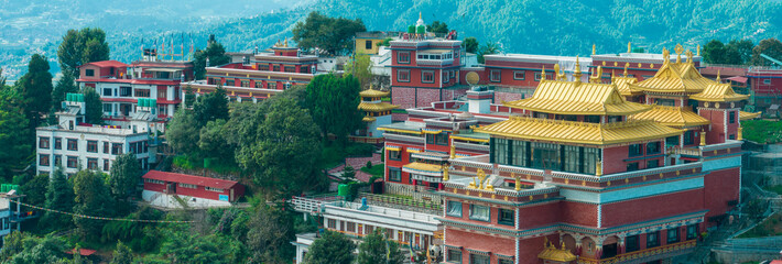 Fototapeta premium Aerial view of the Thrangu Tashi Yangtse Monastery or Namo Buddha Monastery is a Tibetan Buddhist monastery, close to Kathmandu, it lies at the top of the hill. Nepal 10-03-2023