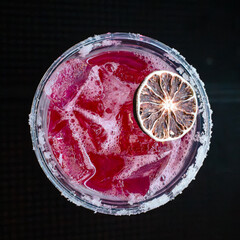 Red Club Drink with Salt Rim and Orange Slice
