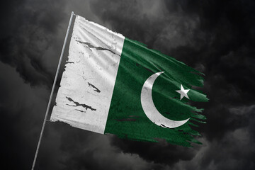 Pakistan torn flag on dark sky background. - obrazy, fototapety, plakaty