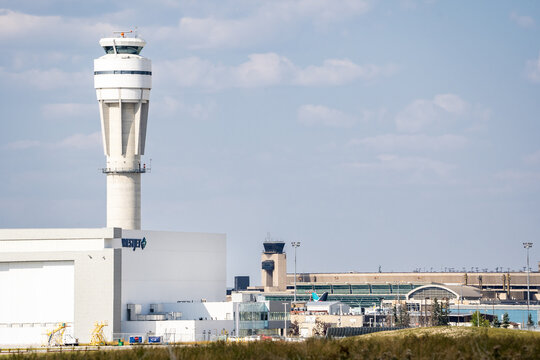 Calgary Alberta Canada, September 24 2023: Air traffic control tower overlooking the Westjet Hanger and YYC terminal.
