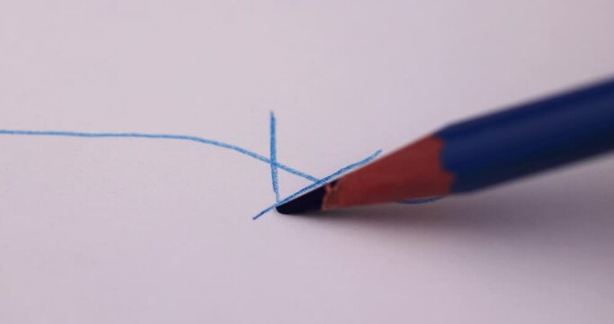 sharp blue pencil on paper close-up , school supplies blue pencil on paper 