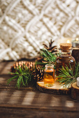 Aromatic home apartment diffuser with the fresh pine fragrance. Spruce, fir tree branches, wooden...