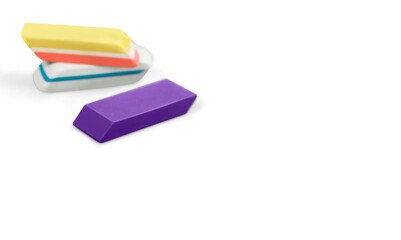 Classic colored school eraser on background