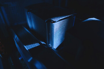 A close-up reveals the ultra-quiet multiple-performance computer CPU cooler, characterized by its pristine blue color cast, embodying the essence of cutting-edge technology