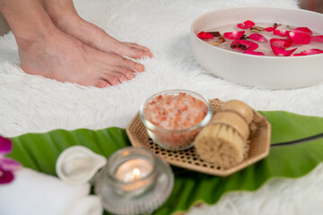 Obraz na płótnie Canvas Woman indulges in blissful foot massage at luxurious spa salon while masseur give reflexology therapy in gentle day light ambiance resort or hotel foot spa. Quiescent