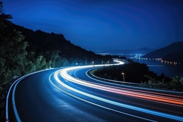 Cars light trails at night in a curve road
