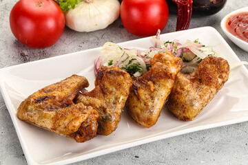 Grilled chicken wings with sauce