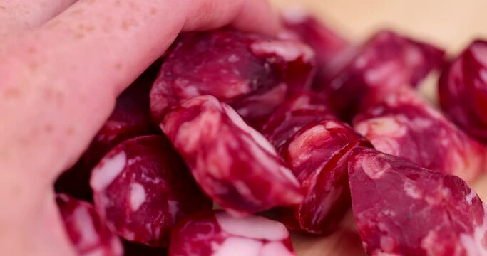 take natural pork meat with spices from which sausage was made, homemade cured sausage with pork