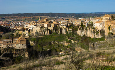 Fototapeta na wymiar Cityscape of Cuenca with view of old tiled buildings. Castilla-La Mancha, Spain.
